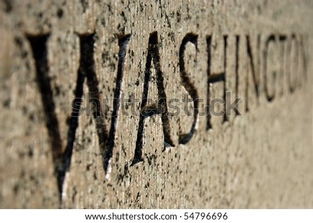 Close-up view of Washington sign on World War II memorial in Washington DC.