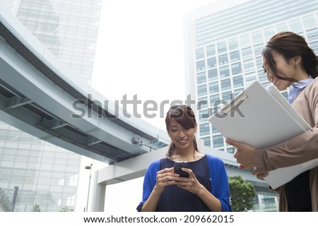 Women conversation with a smart phone