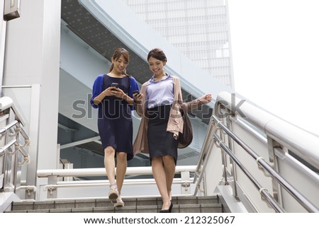 Business Woman that conversation on the stairs