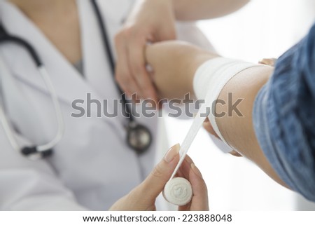 Patients are wound a bandage to doctor