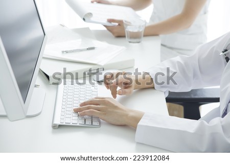 Doctor operating the computer