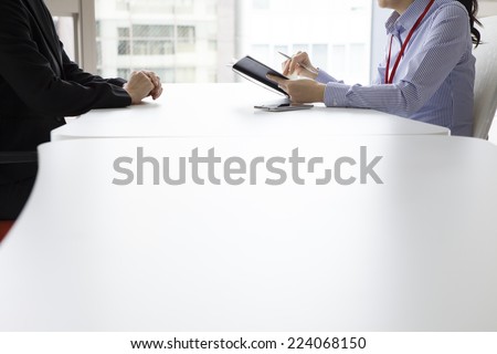 Two women on a conversation in the office