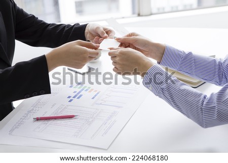Exchanging business cards in the office