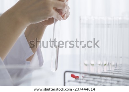 Scientist is checking the medicine in the test tube