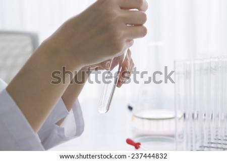 Scientist is checking the medicine in the test tube