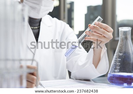 The scientist checking medicine in the test tube