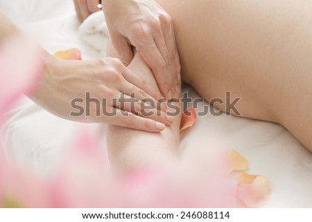 Women undergoing upper arm massage