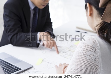 Young couple visiting the real estate office