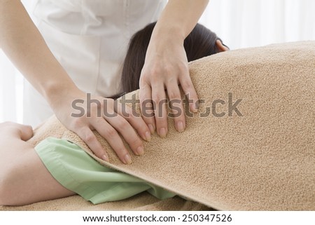 Woman massaging an upper arm