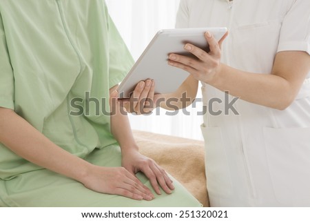 Obstetrician gynecologist with an electronic tablet