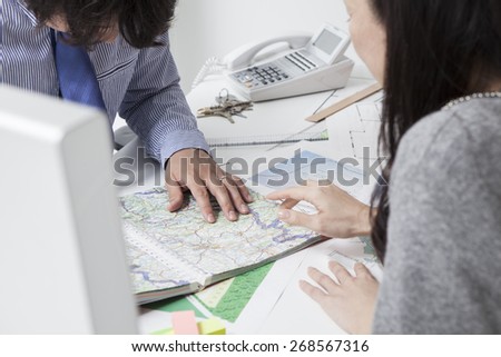 Moving concept - women with map in the city