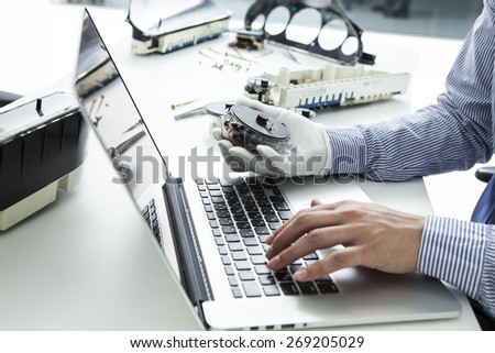 Computer technician having a lot of work