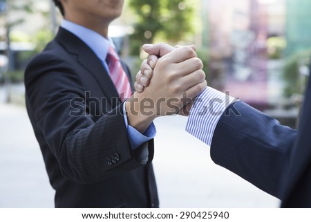 Businessman giving a handshake