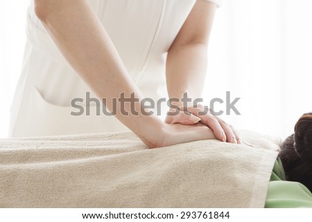 Picture of happy beautiful woman in massage salon