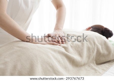 Picture of calm beautiful woman in massage salon