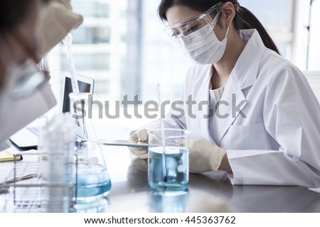 Science students working with chemicals in the lab at the university.