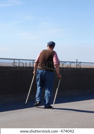 Old man with two walking sticks