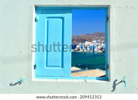 Traveling concept - window into beauty of Greece and Cyclades islands showing Little Venice in Mykonos