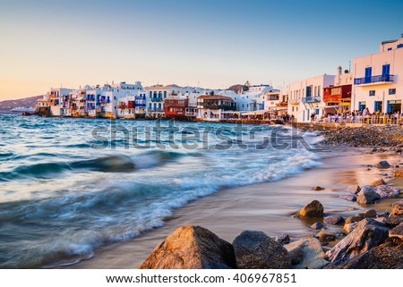 Rolling waves and sunset dining at famous Mykonos neighborhood of Little Venice, Mykonos, Greece