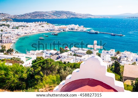 Panoramic view of the Mykonos town harbor from the above hills on a sunny summer day, Mykonos, Cyclades, Greece