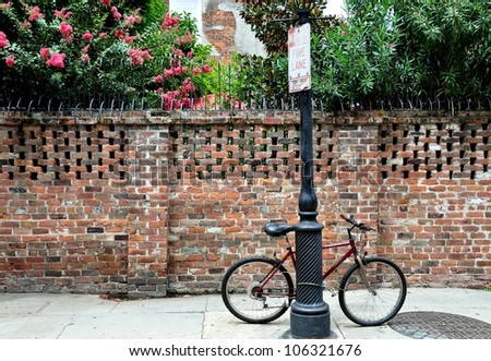 A Bicycle Locked To A Pole In The New Orleans French Quarter