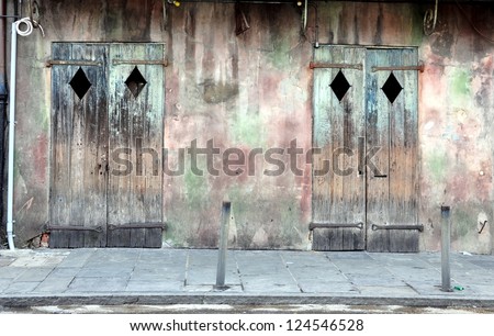 Old Exterior Wall With Wooden Doors In New Orleans French Quarter