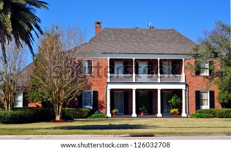 A Beautiful Two Story Brick House With Balcony