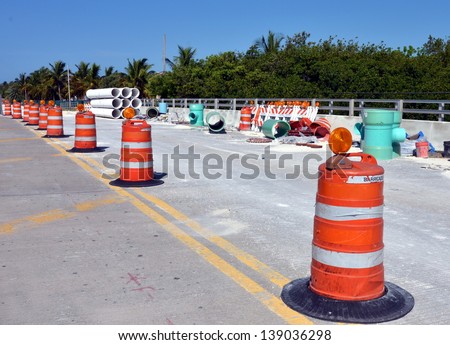 Barricades And Large Sewer Pipes On A Road Construction Site