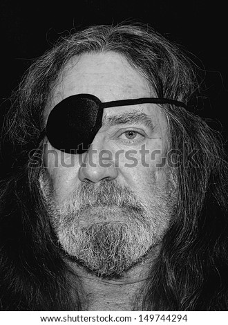 Black And White Portrait Of A Senior Caucasian Man With Long Hair And A Eye Patch