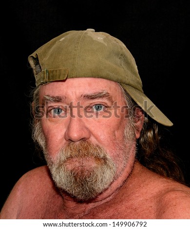 Portrait Of An Old Sea Captain Wearing A Baseball Cap