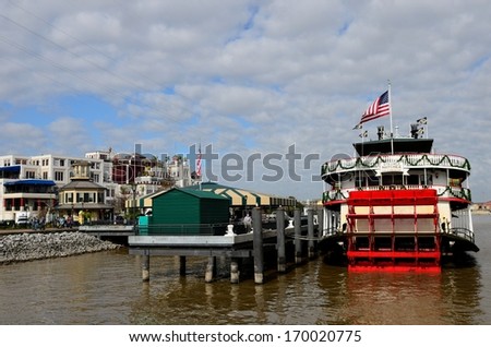NEW ORLEANS, LOUISIANA - JANUARY 4: the steamer NATCHEZ is docked on the Mississippi River at the New Orleans French Quarter on January 4, 2014.  The ship offers cruises along the Mississippi River.