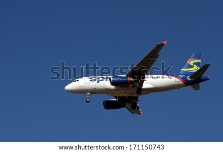 NEW ORLEANS, LA. - JANUARY 11:  A Spirit Airline Airbus A319 on final approach to New Orleans International Airport on January 11, 2014.  Spirit is a low cost carrier headquartered in Miramar, Fl.