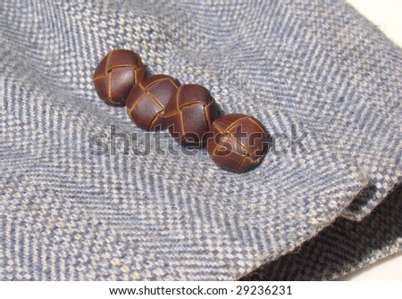 Leather Buttons On Tweed Jacket Sleeve
