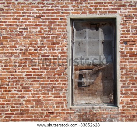 Old Screen Window In Brick Wall