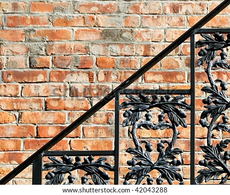 Decorative Wrought Iron Railing With Brick Background