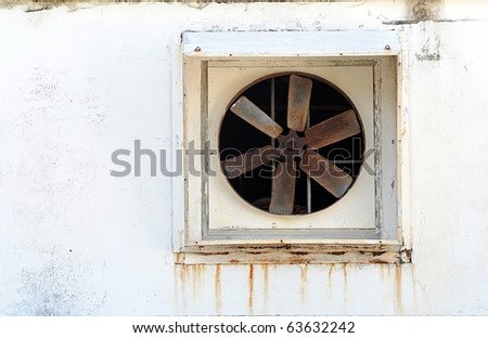Old Power Ventilator Fan On Stucco Wall