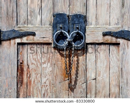 Antique Wooden Doors With Black Wrought Iron Hinges, Ring Pulls, Chain And Padlock