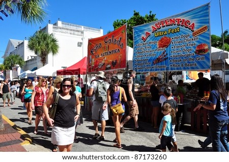 KEY WEST, FLORIDA - OCTOBER 22: Visitors pass by booths at the Goombay Festival in Bahama Village on October 22, 2011 in Key West, Fl. This is an annual event, and marks the start of Fantasy Fest.