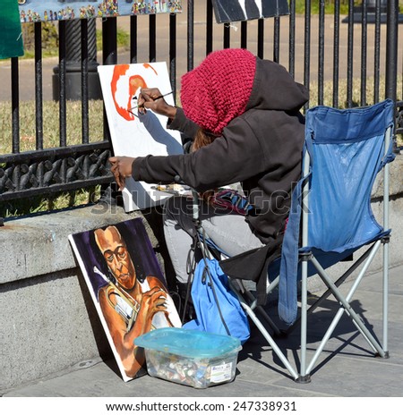 NEW ORLEANS, LA-JAN. 24:  A local artist painting in front of Jackson Square in the New Orleans French Quarter on January 24, 2015.