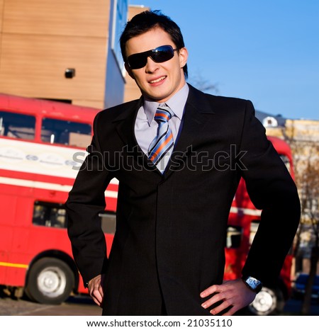 Positive portrait of young businessman outdoors