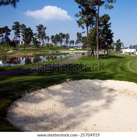 Beautiful view of golf sand trap and pond