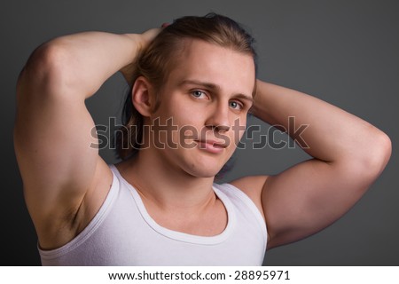 ?lose up portrait of blond man over gray background