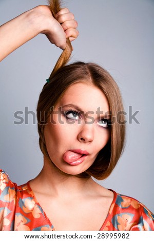 stock photo Funny attractive housewife after hard day's work indoors