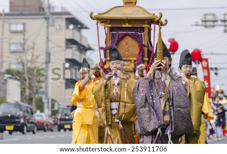 KYOTO, JAPAN - APRIL 12, 2014: Yasurai Matsuri, festival which people dressed in period costume carry a decorated canopy with four 