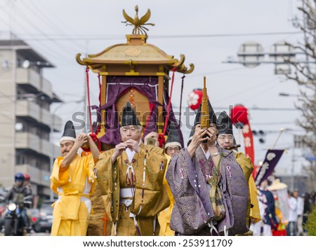 KYOTO, JAPAN - APRIL 12, 2014: Yasurai Matsuri, festival which people dressed in period costume carry a decorated canopy with four 