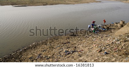 women washing clothes in the river
