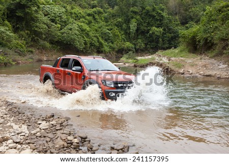 Lang Son, Viet Nam - Nov 4, 2014: Ford Ranger Wildtrak crossing river in Vietnam
