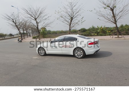 Ha Noi, Viet Nam - Jan 24, 2015: Jaguar XF car running on the road test in Vietnam