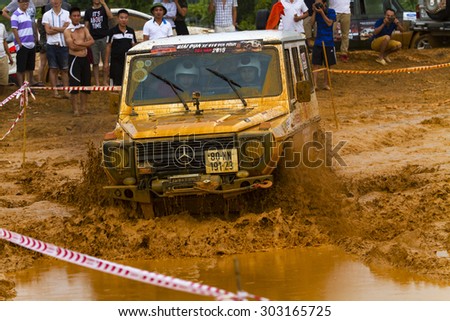 Hanoi, Vietnam: July 4, 2015: Mercedes-Benz G-Class at terrain racing car competition, off-road with  mud road, competitor adventure in championship spirit at public race in Viet Nam.