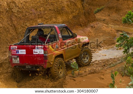 Hanoi, Vietnam: July 5, 2015: Suzuki Samurai car at terrain racing car competition, off-road with mud road, competitor adventure in championship spirit at public race in Viet Nam.